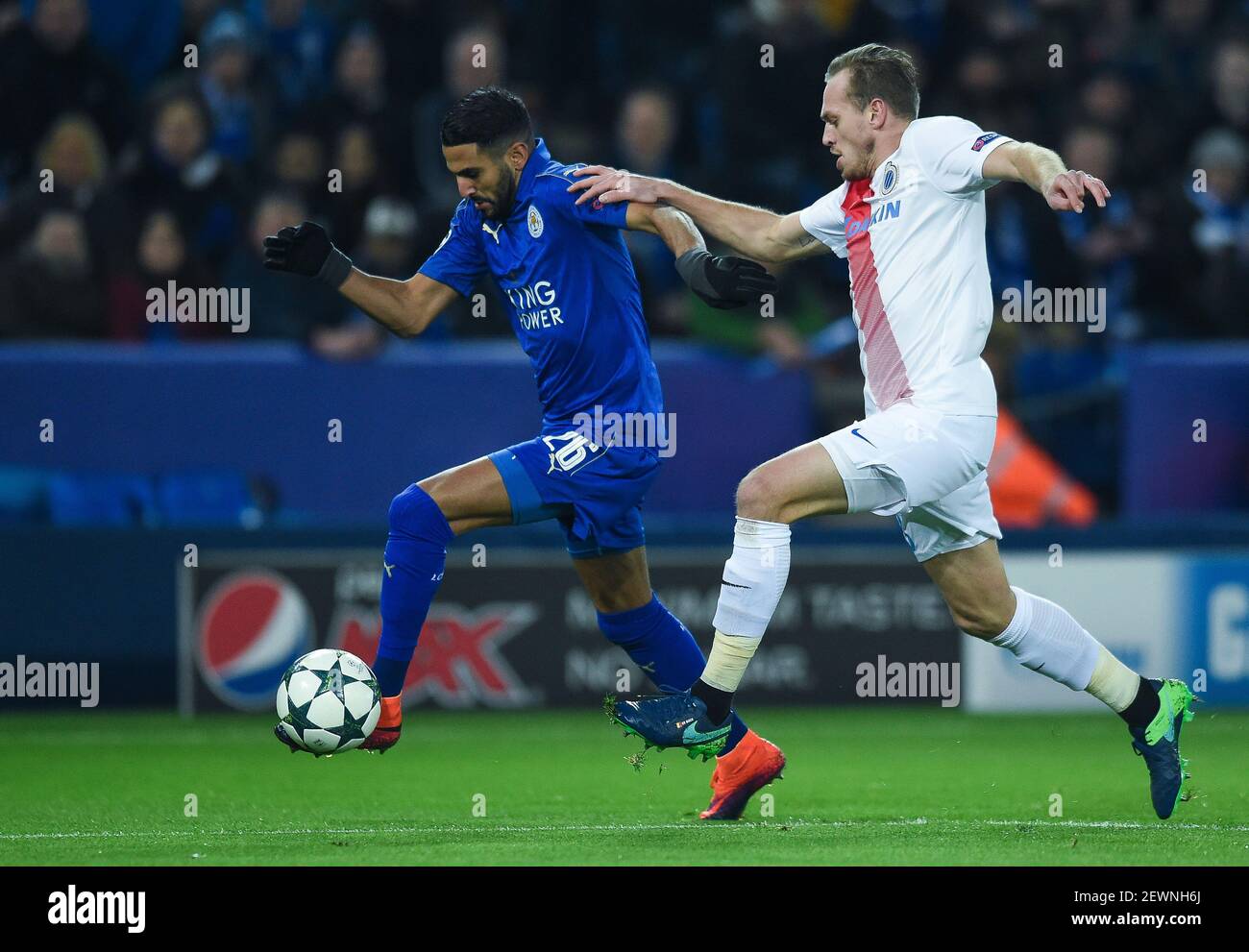 Riyad Mahrez Of Leicester City Is Challenged By Laurens De Bock Of Club Brugge During The Group G Champions League Match Between Leicester City And Club Brugge At The King Power Stadium