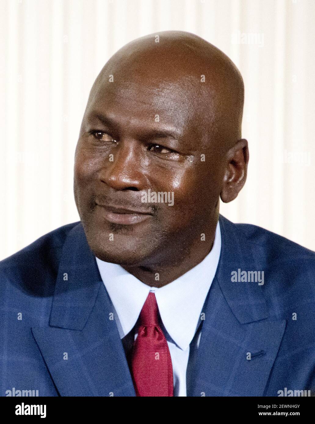 Former NBA star Michael Jordan looks on as United States President Barack  Obama makes remarks at a ceremony in the East Room of the White House in  Washington, DC where he is