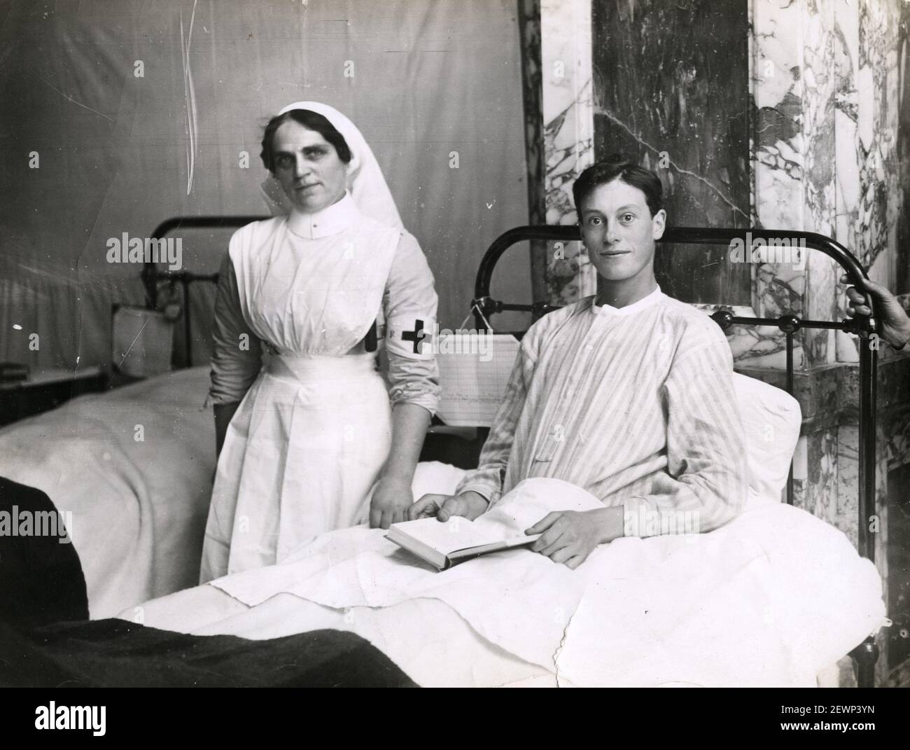 Vintage World War One photograph - WWI: soldier in military hospital, with nurse. Stock Photo