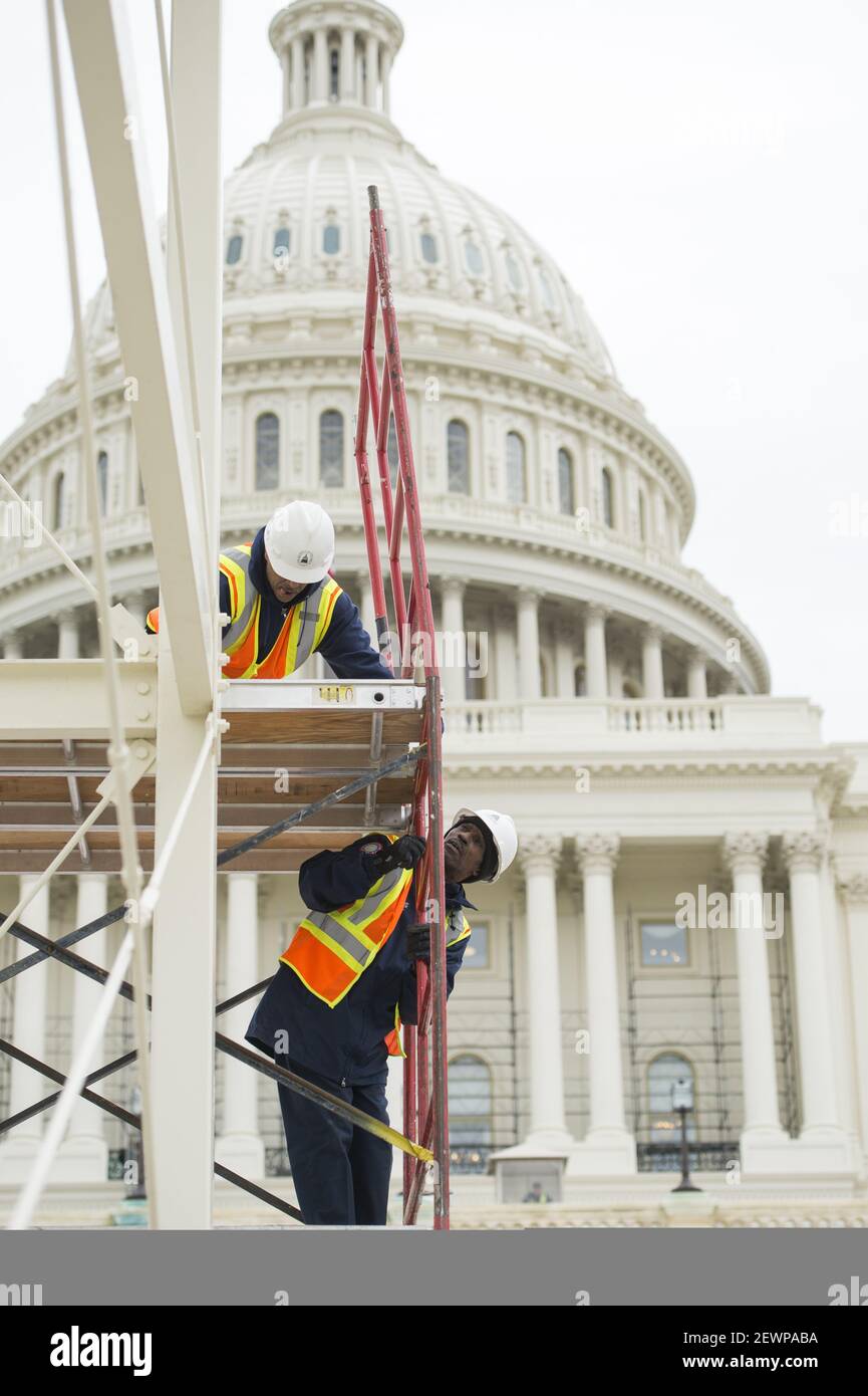 UNITED STATES - DECEMBER 08: Architect of the Capitol employees install scaffolding to work on the center camera stand while preparing for the presidential inauguration on the West Front of the Capitol, December 08, 2016. (Photo By Tom Williams/CQ Roll Call) *** Please Use Credit from Credit Field *** Stock Photo