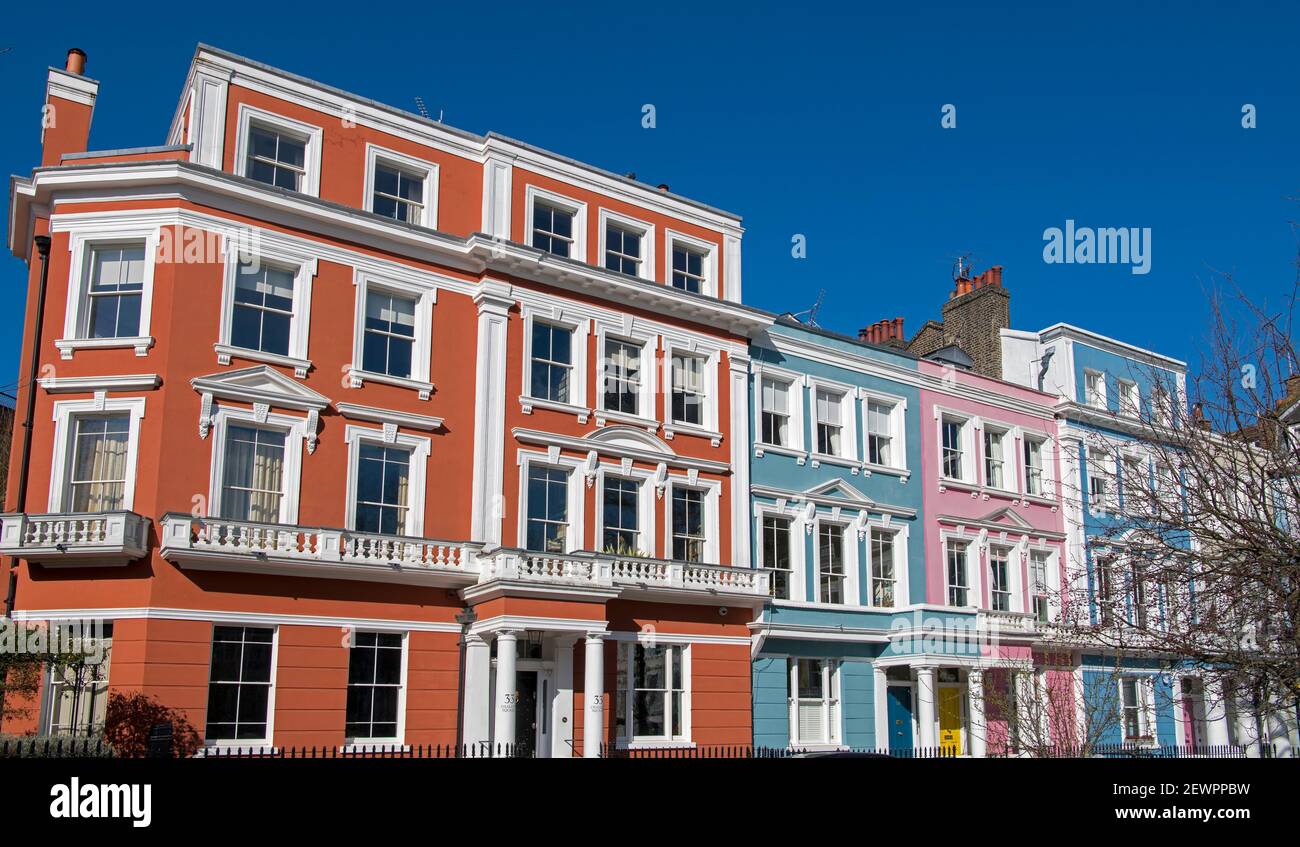 Brightly coloured Italianate terraced houses grade ll listed Chalcot Square Primrose Hill London England Stock Photo