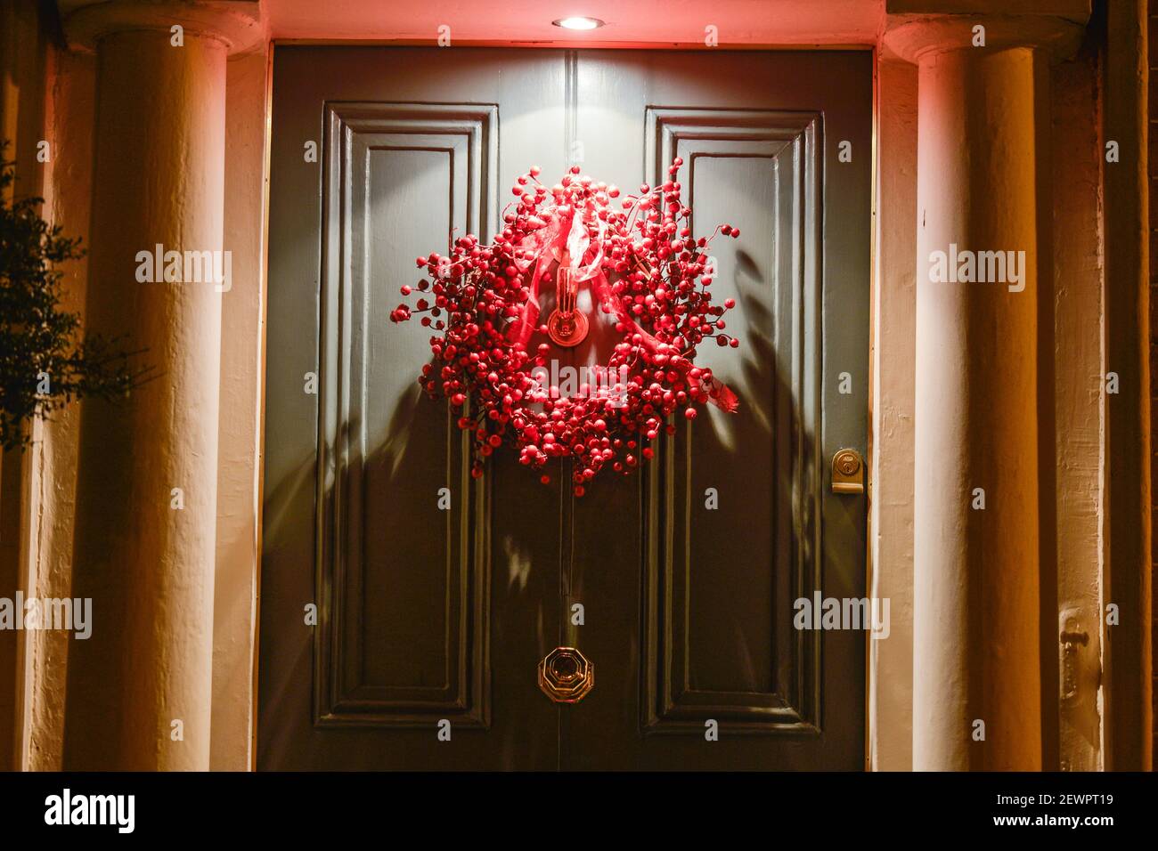 A door decorated with Christmas decorations at a house in ...