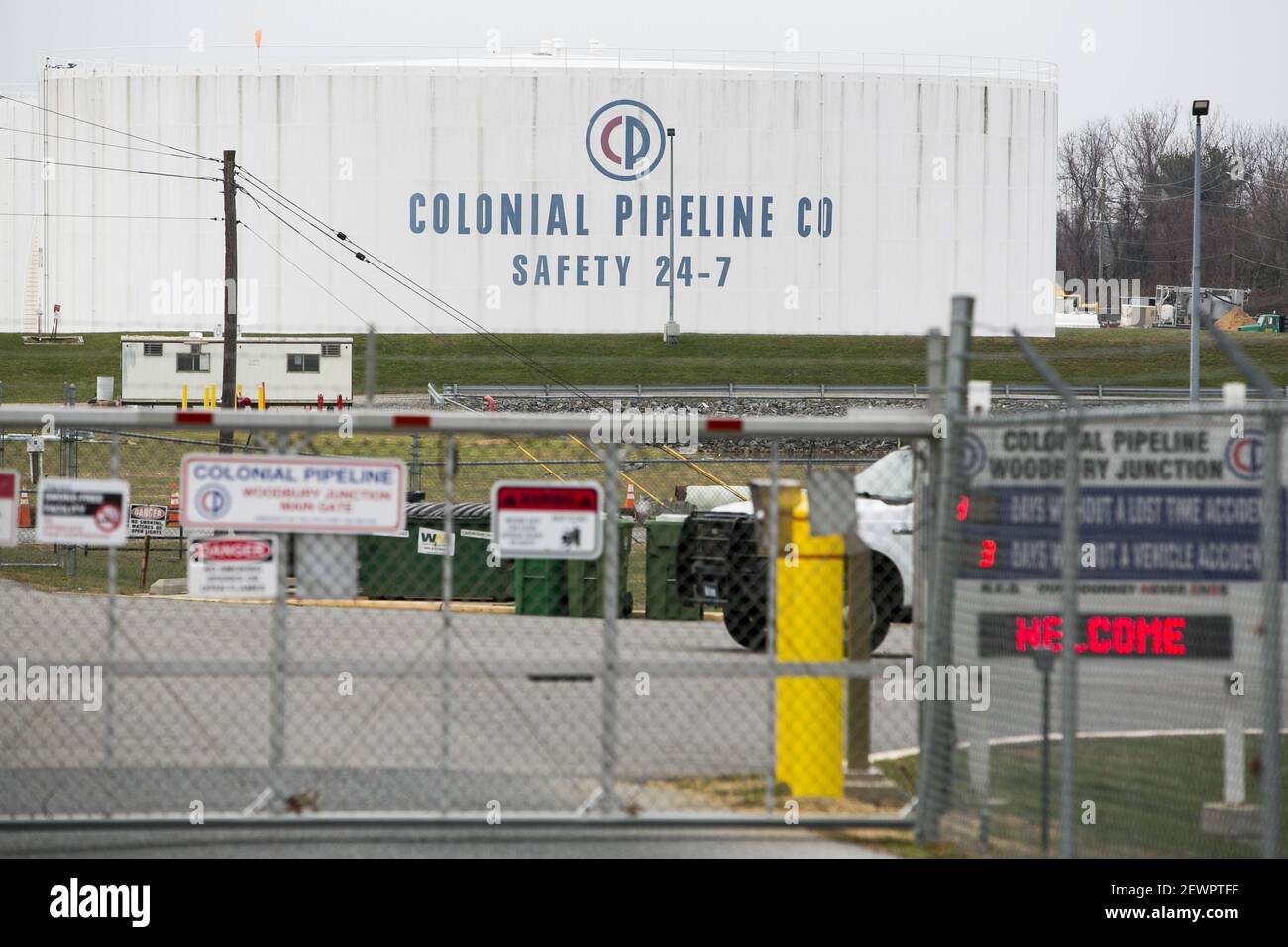 A logo sign outside of a Colonial Pipeline Company Tank Farm in