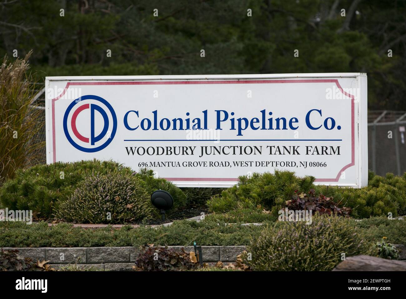 A logo sign outside of a Colonial Pipeline Company Tank Farm in