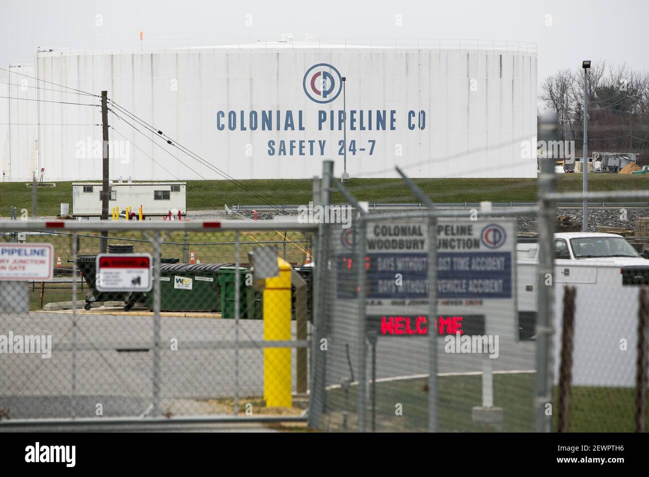 A logo sign outside of a Colonial Pipeline Company Tank Farm in