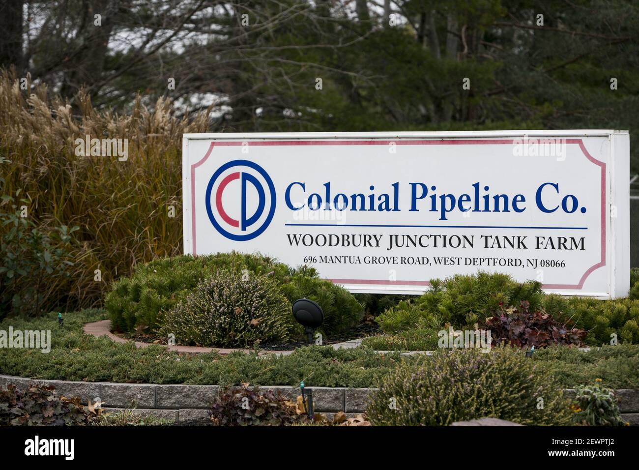 A logo sign outside of a Colonial Pipeline Company Tank Farm in