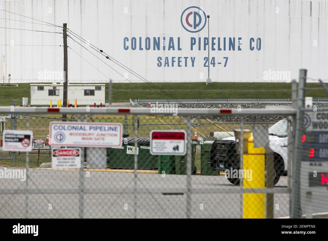 A logo sign outside of a Colonial Pipeline Company Tank Farm in