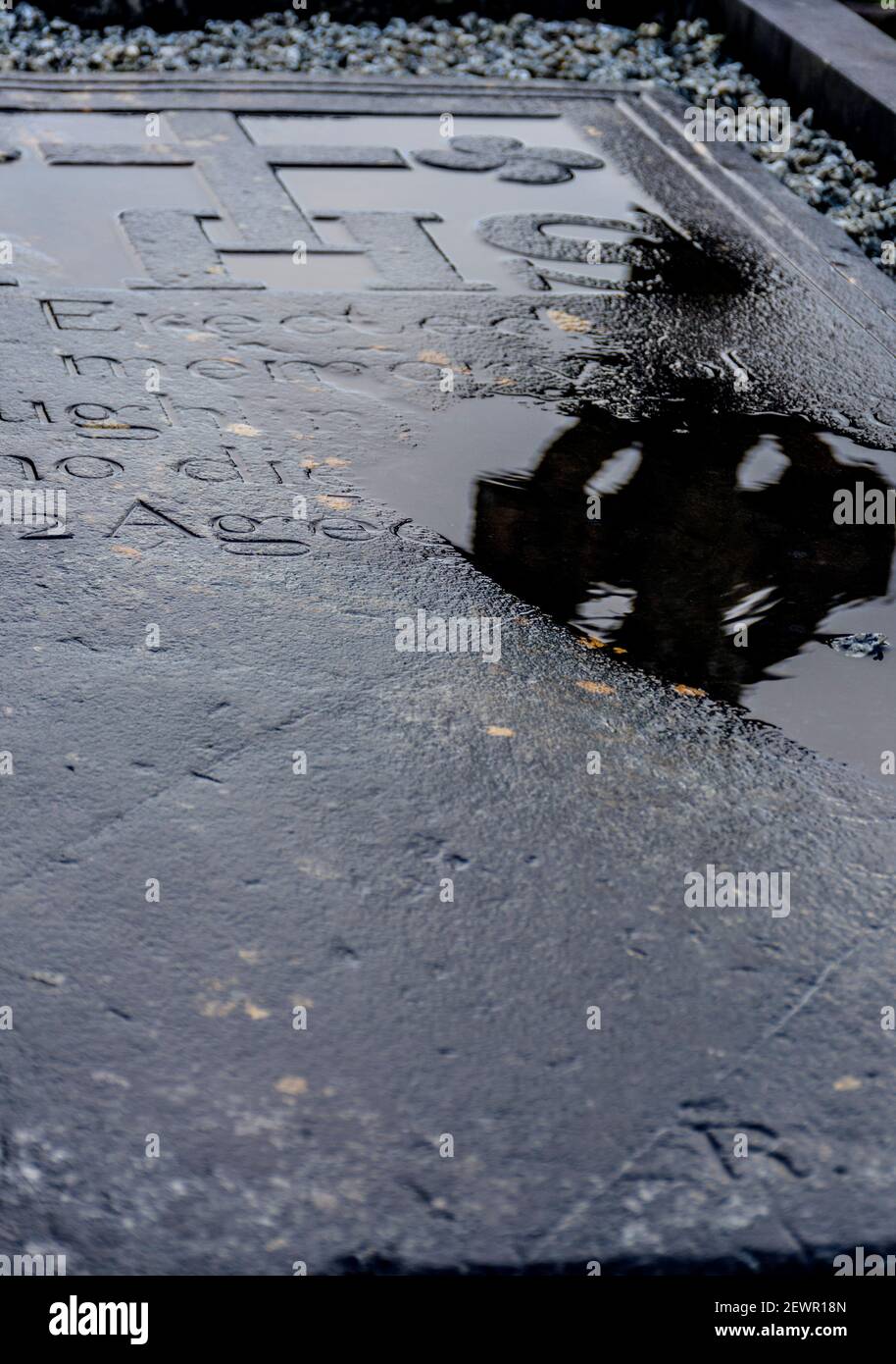 Old Irish gravestone with Celtic cross reflection in rain Stock Photo ...