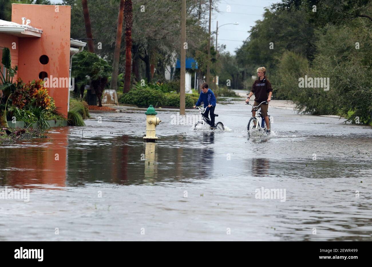 Bicyclists Make Their Way Through A Flooded Street As Heavy Rains From Hurricane Matthew Cause Flooding Thursday Oct 7 16 In New Smyrna Beach Fla As The Category 4 Storm Brushed The Bicyclists Make Their Way Through A Flooded Street As Heavy Rains From Hurricane Matthew Cause Flooding Thursday Oct 7 16 In New Smyrna Beach Fla As The Category 4 Storm Brushed The