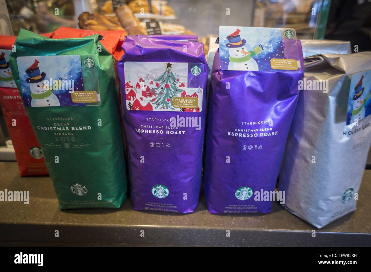 A display of Starbucks Christmas themed blends of coffee ...