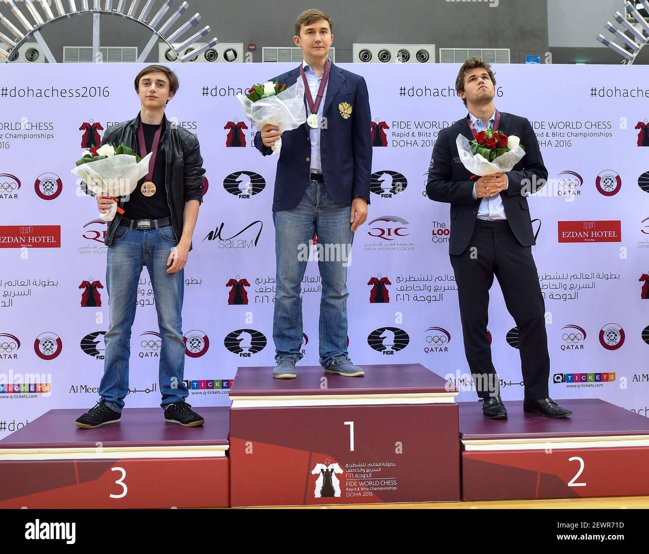 L to R) Bronze medalist Daniil Dubov of Russian , gold medalist Sergey  Karjakin of Russian and silver medalist Magnus Carlsen of Norway pose on  the podium at the medal ceremony for