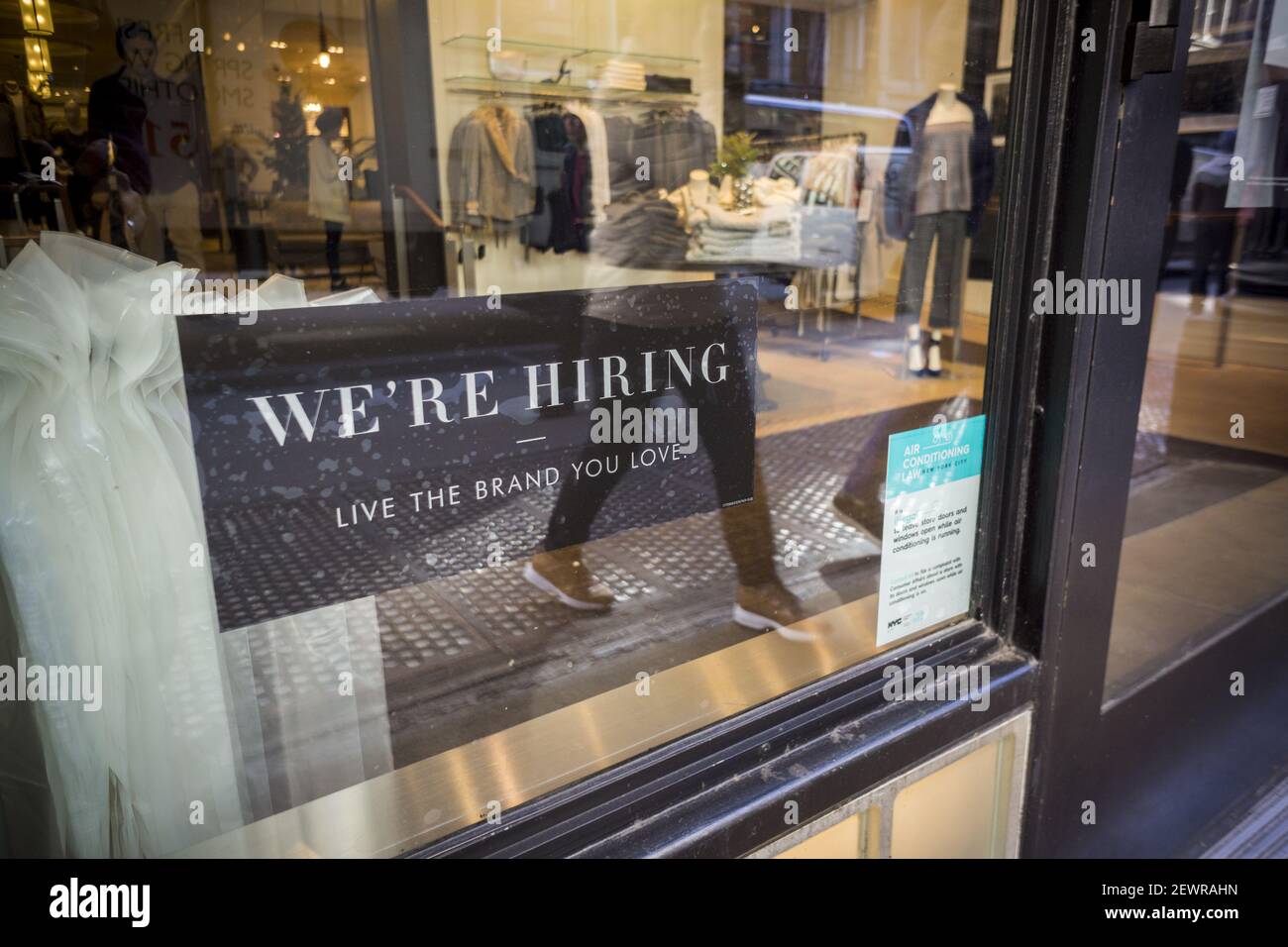A sign in the window of a Banana Republic store in New York advertises for  workers, seen on Friday, November 11, 2016. The ADP National Employment  Report reports that hiring by private