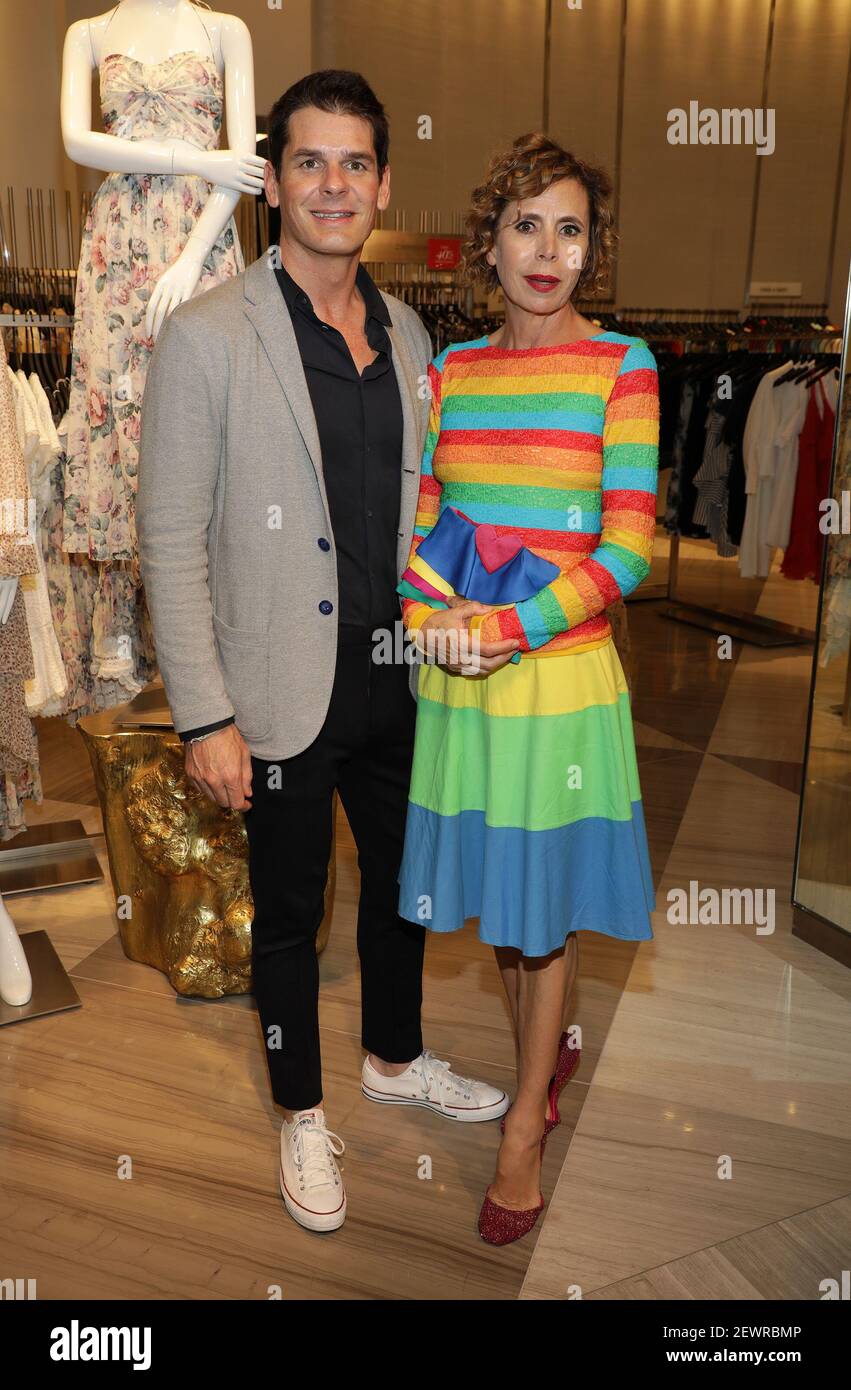 MIAMI, FLORIDA - MAY 31: Julio Iranzo and designer Agatha Ruiz de la Prada  are seen during Miami Fashion Week 2017 Kick Off Party at Saks Fifth Avenue  Brickell on May 31,