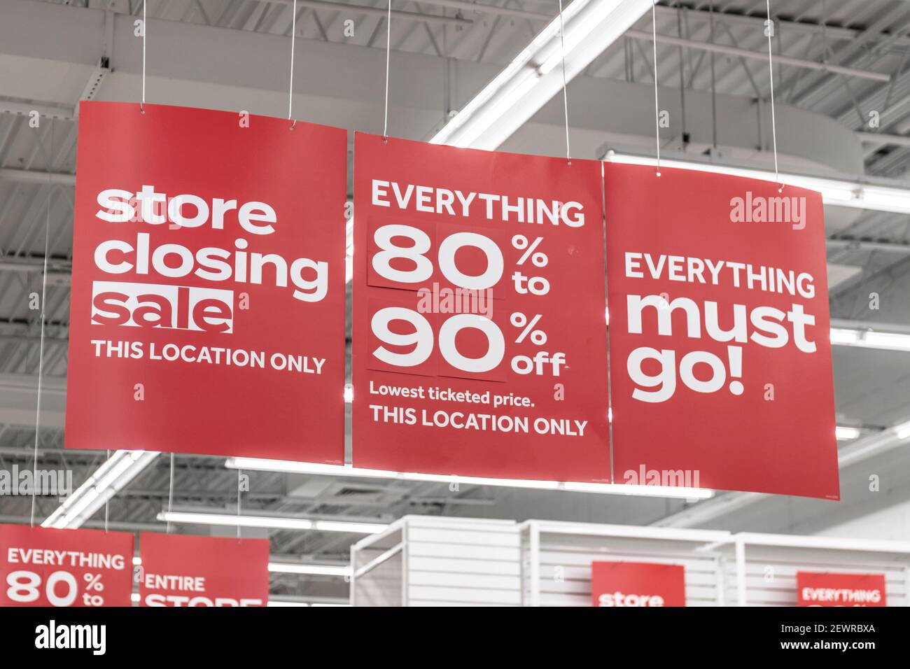 Warehouse clearance sale red sign Stock Photo - Alamy