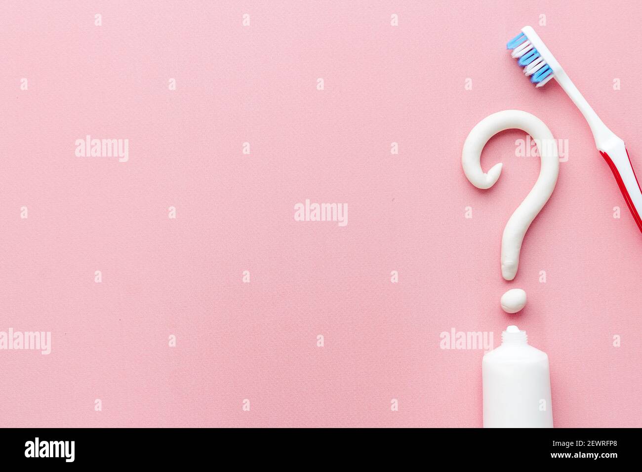 Question mark of toothpaste with toothbrush, top view. Oral care and