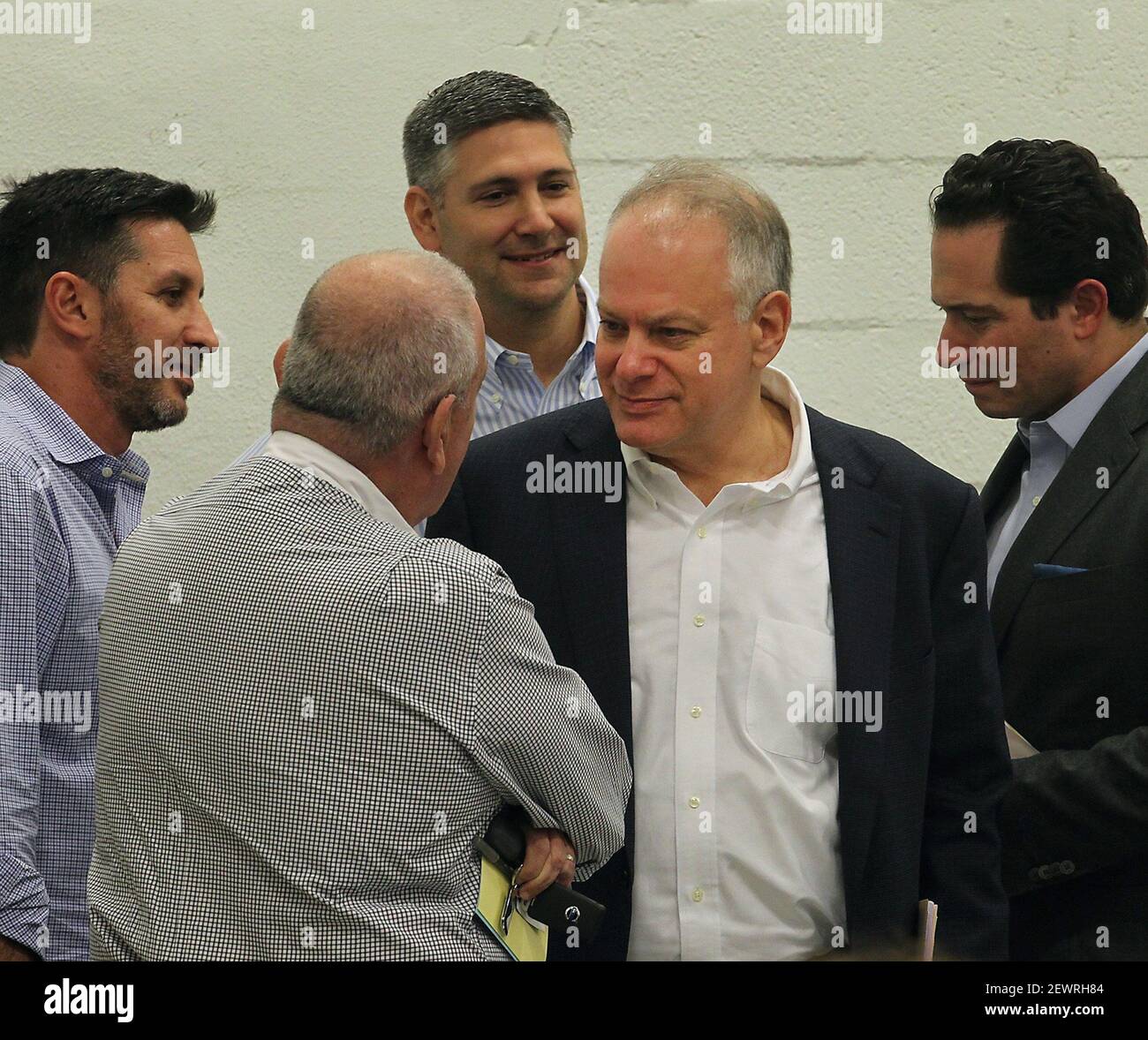Stephen Bittel, center, chats with voters as members of the Miami-Dade Democratic Party Executive Committee met in Wynwood, Fla., on Dec. 20, 2016, to elect a new state committeeman. Bittel has resigned. (Photo by Patrick Farrell/Miami Herald/TNS/Sipa USA) Stock Photo