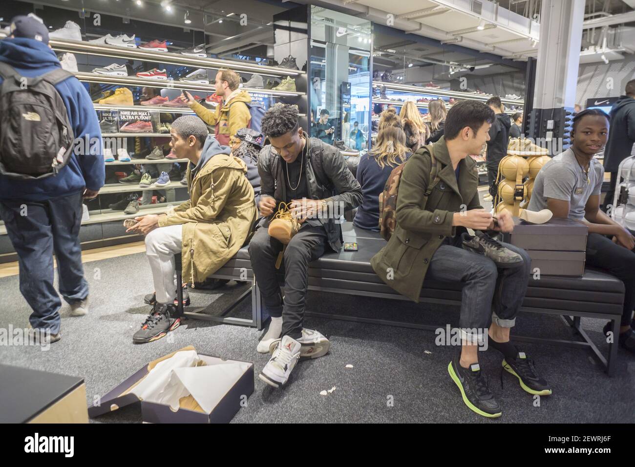 Customers crowd the new Nike flagship store on opening day in Soho in New York on Friday