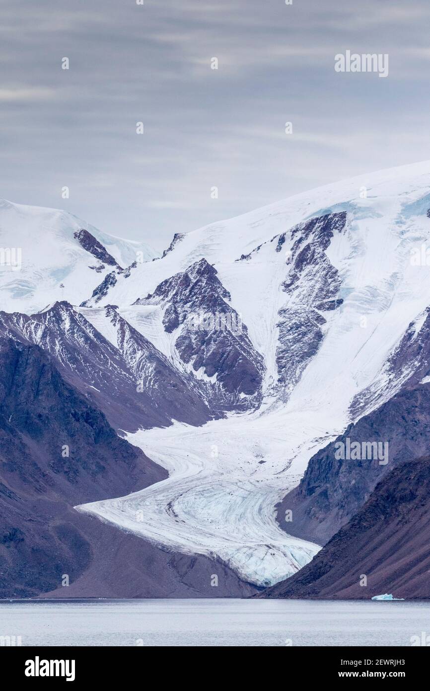 Tidewater glacier in the calm waters of Makinson Inlet, Ellesmere Island, Nunavut, Canada, North America Stock Photo