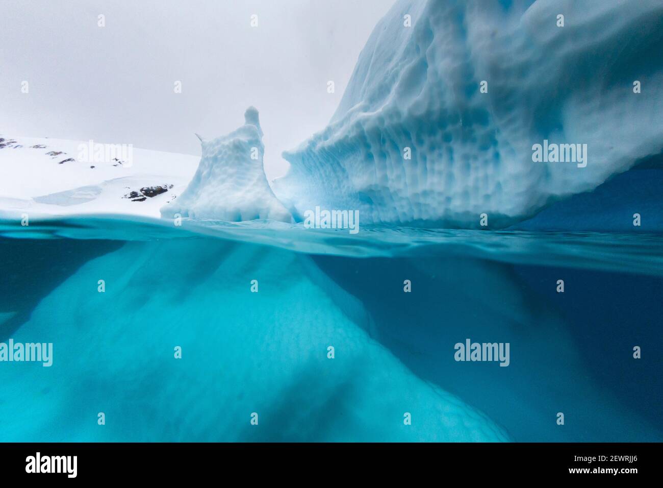Above and below view of an iceberg at Cuverville Island, Ererra Channel, Antarctica, Polar Regions Stock Photo