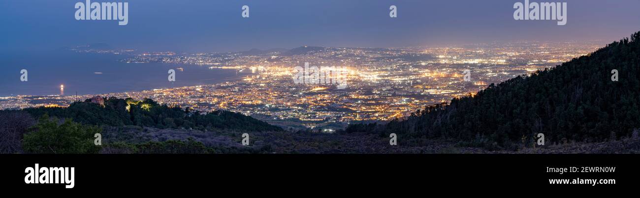 Panoramic of Naples city lights and Gulf at dusk from Vesuvius, Naples, Campania, Italy, Europe Stock Photo