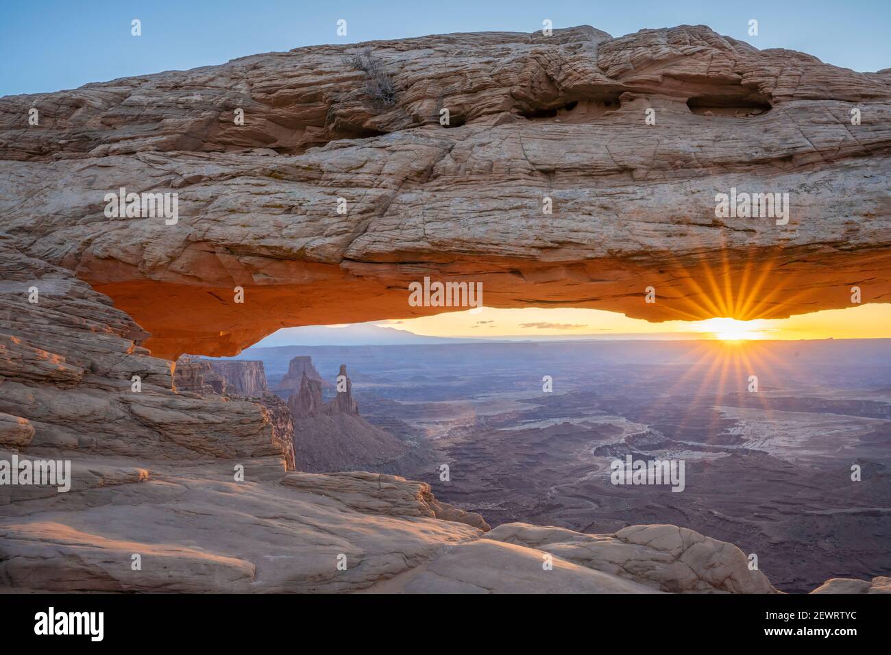 Close up view of canyon through Mesa Arch at sunrise, Canyonlands National Park, Utah, United States of America, North America Stock Photo