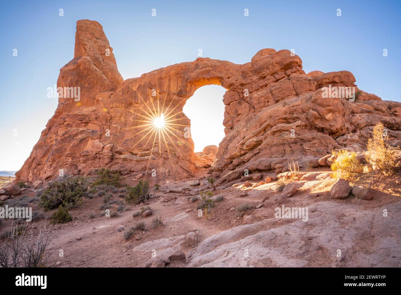 Sunburst through Turret Arch, Arches National Park, Utah, United States of America, North America Stock Photo