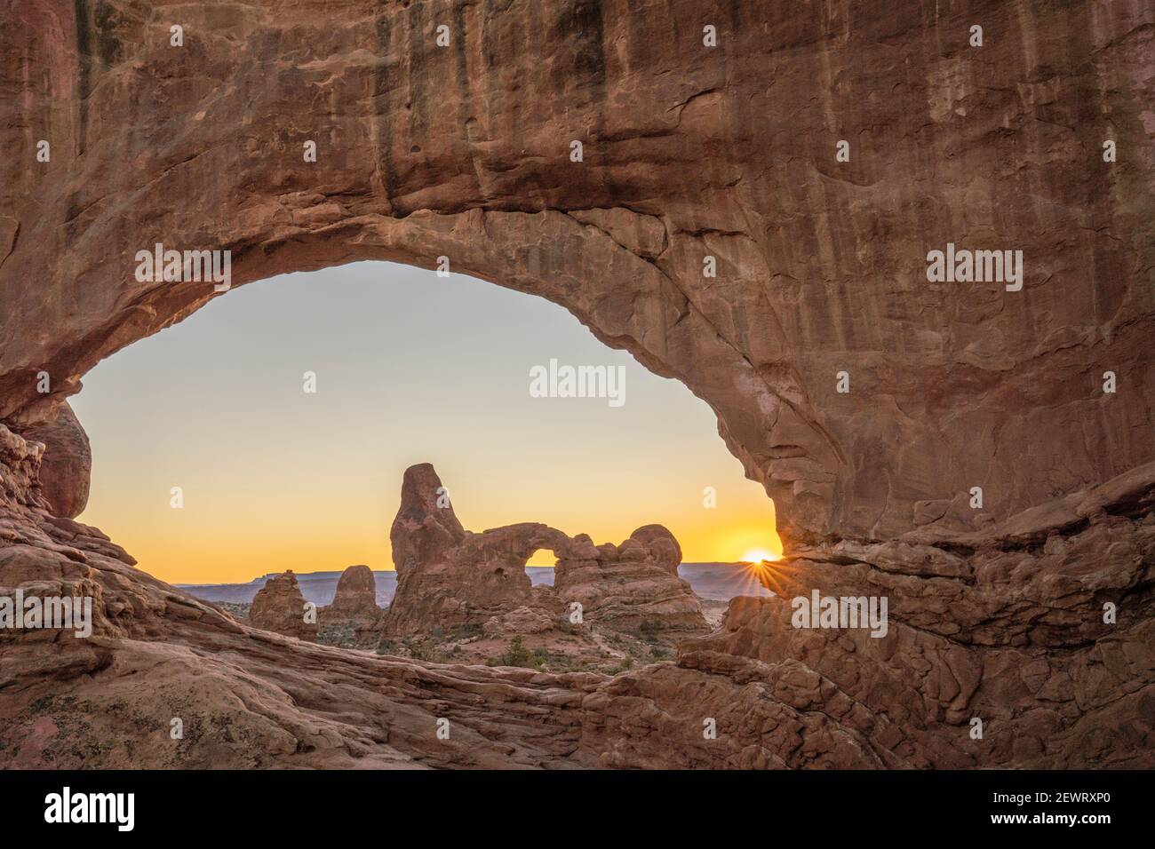 Sunset and Turret Arch view through Windows Arch, Arches National Park, Utah, United States of America, North America Stock Photo