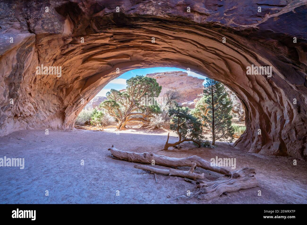 Landscape view through Navajo Arch, Arches National Park, Utah, United States of America, North America Stock Photo