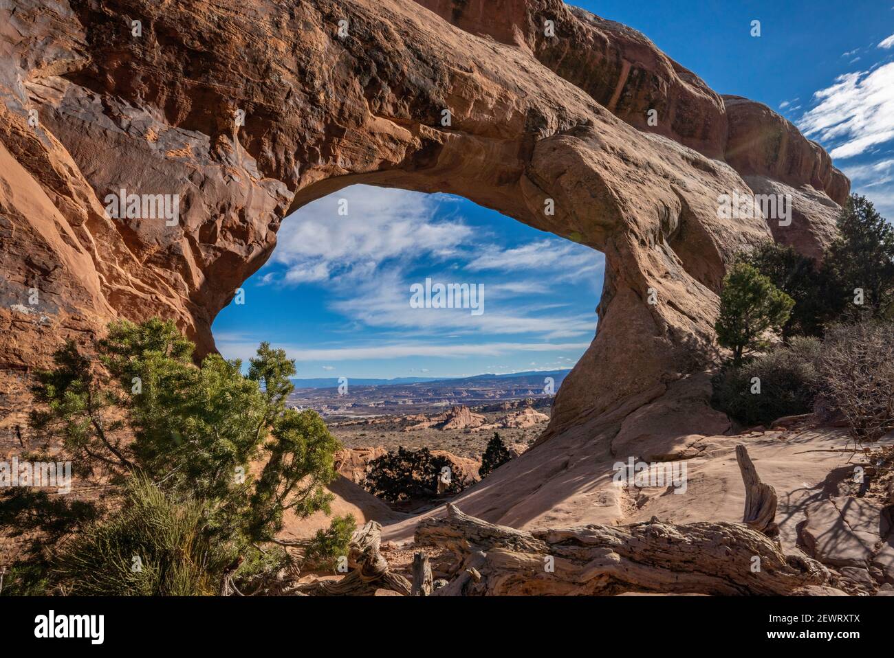Desert landscape viewed through Partition Arch, Arches National Park, Utah, United States of America, North America Stock Photo