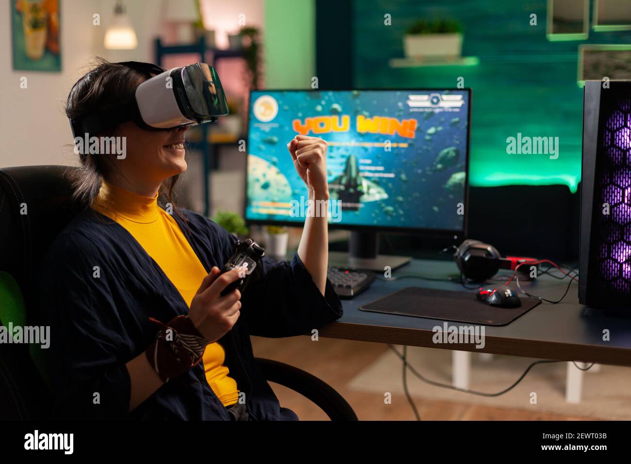 Free Photo  Person playing video games with controller on computer. player  using joystick and wearing headphones to play online game on monitor.  modern man using gaming equipment to have fun.