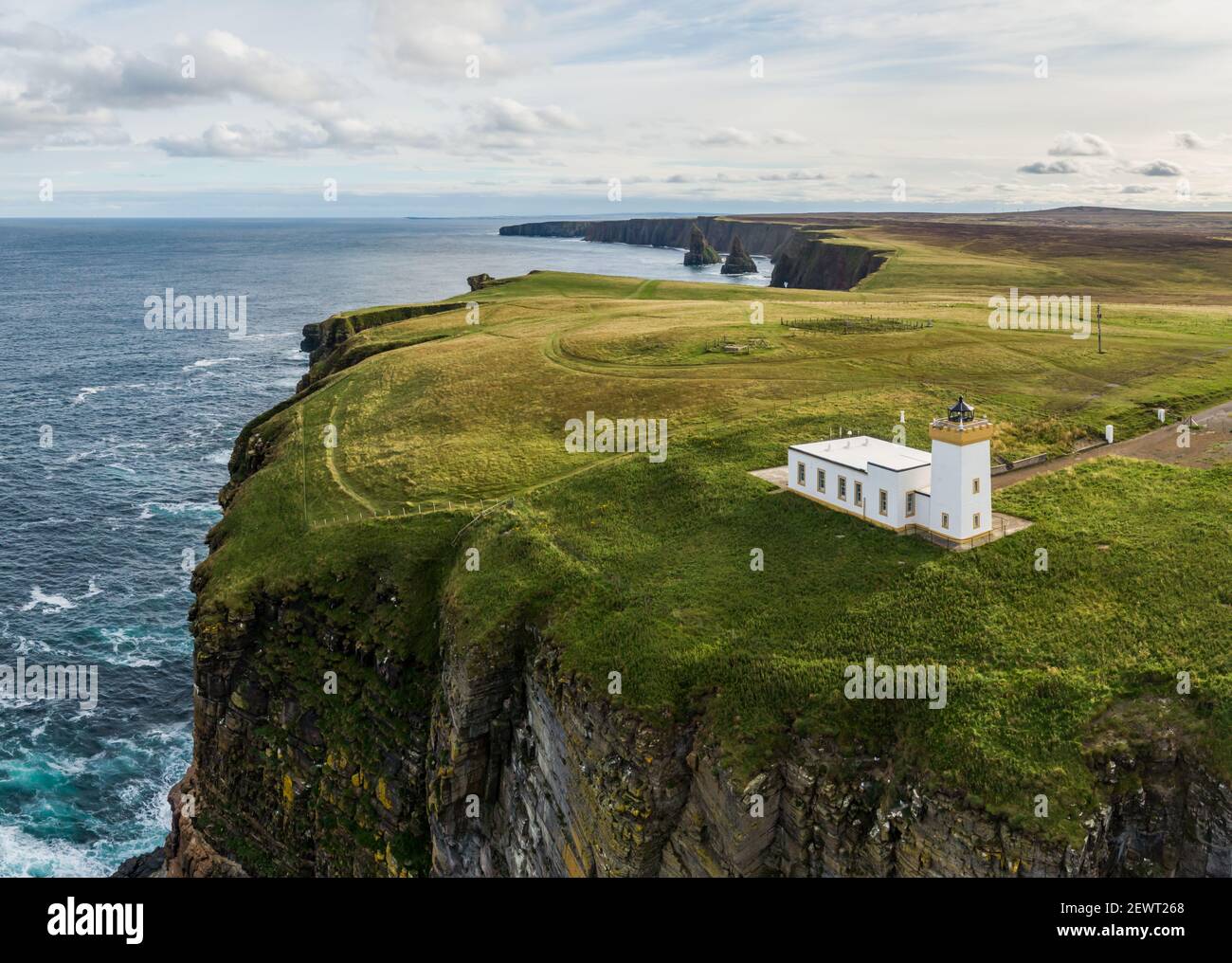 An aerial view of Duncansby Head lighthouse on a sunny day, near John O' Groats, Scotland, UK Stock Photo