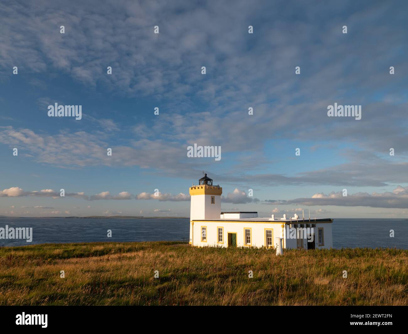Duncansby Head lighthouse on a sunny day, near John O' Groats, Scotland, UK Stock Photo