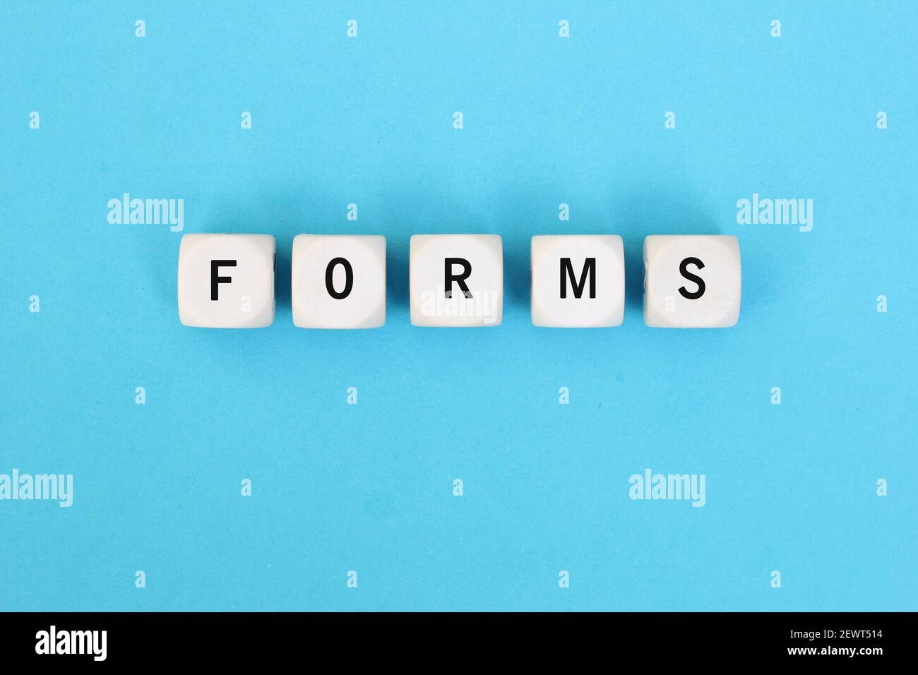 The word form on wooden cubes against paper and folder documents