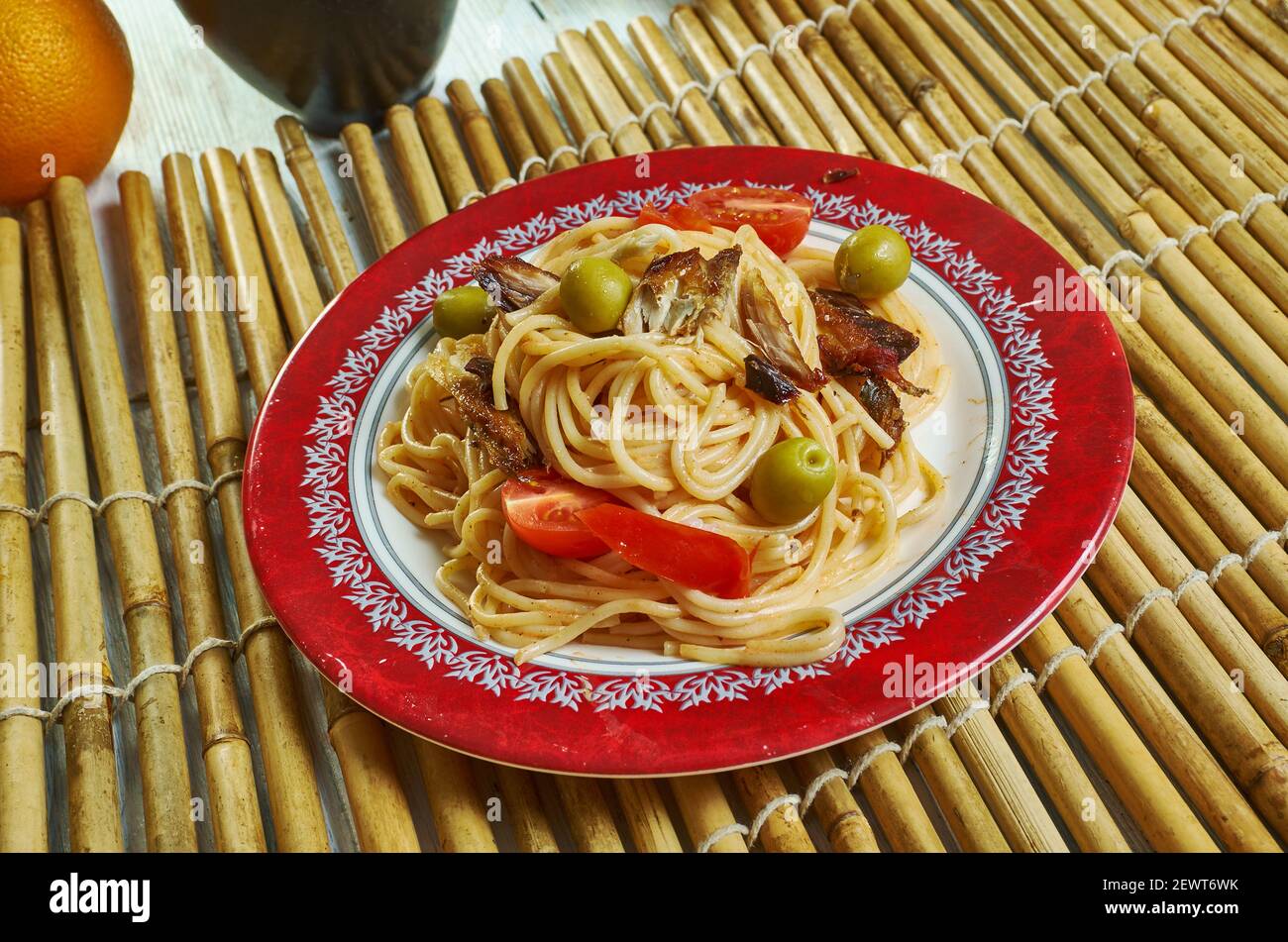 Salsa spaghetti with sardines Add the chilli flakes, tomatoes Stock Photo Alamy