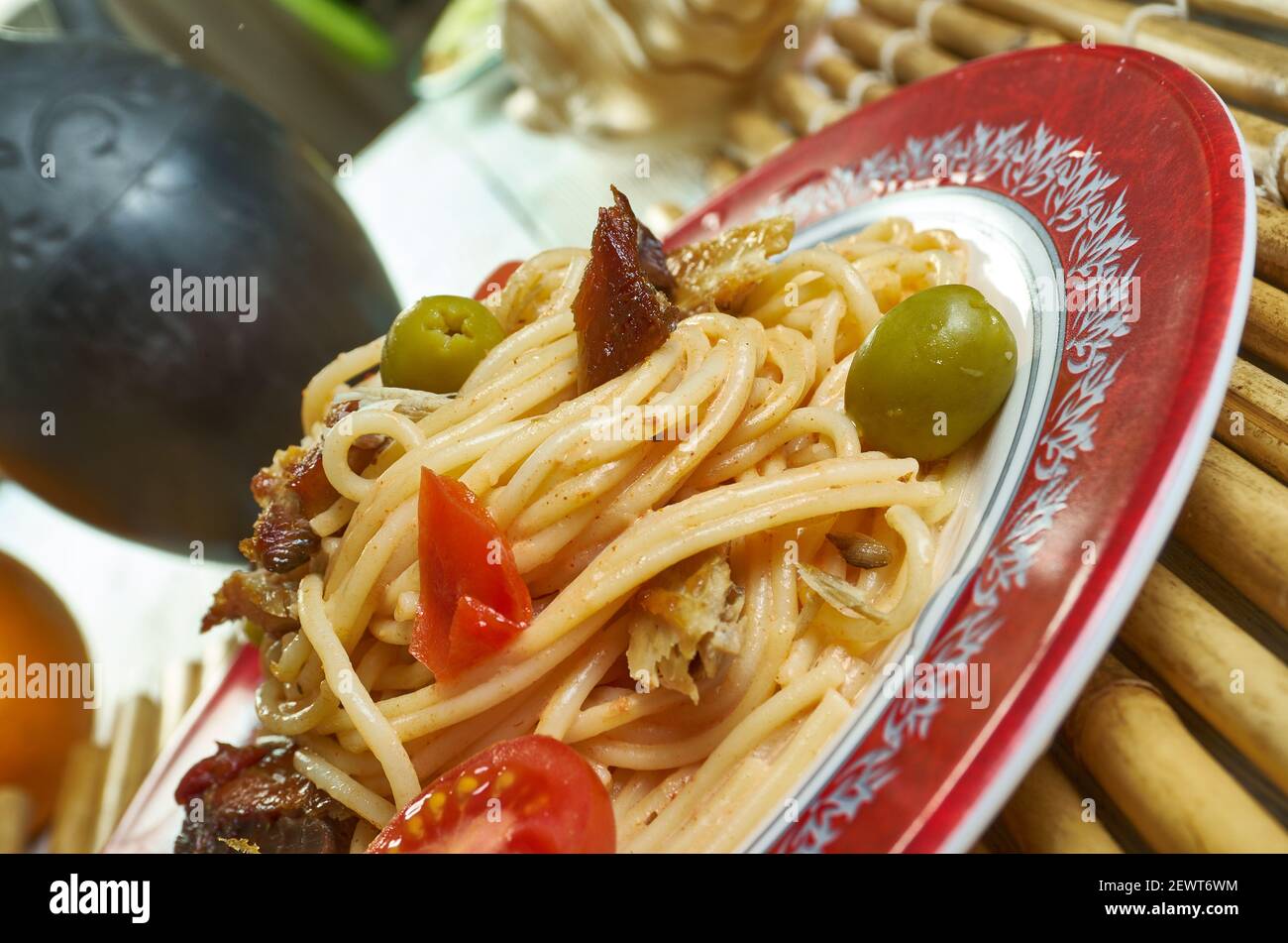 Salsa spaghetti with sardines Add the chilli flakes, tomatoes Stock Photo Alamy