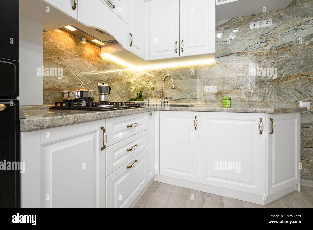 Modern classic white kitchen interior with wooden furniture Stock Photo
