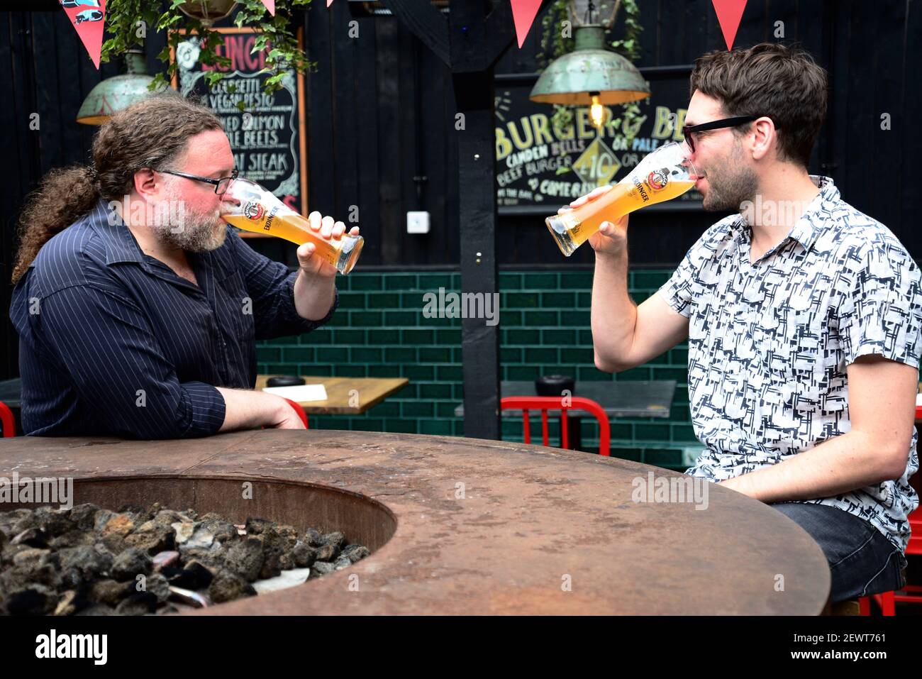Men drinking pints of Erdinger beer at The Lock Tavern, Camden, London Stock Photo
