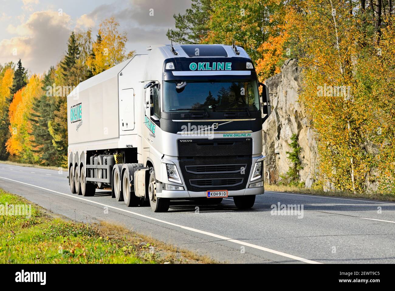 Silver Volvo FH truck of Okline Oy glass trailer along Highway 10 on a beautiful day of autumn. Tammela, Finland. October 2, 2020. Stock Photo