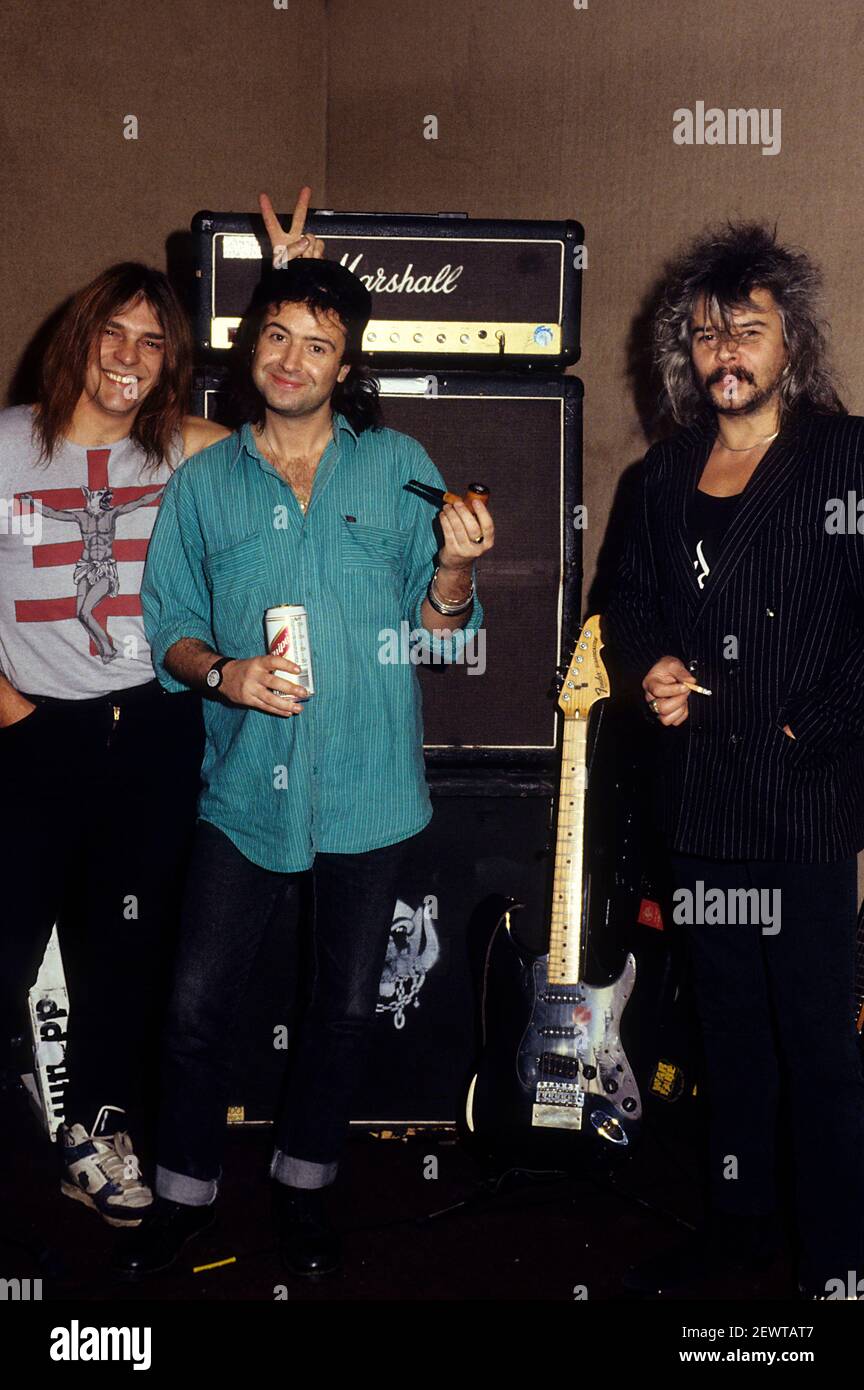 Michael 'Root' Burston, Phil 'Wizzo' Campbell and Phil 'Philthy Animal'  Taylor of Motorhead during a photoshoot at the recording studio. London,   | usage worldwide Stock Photo - Alamy
