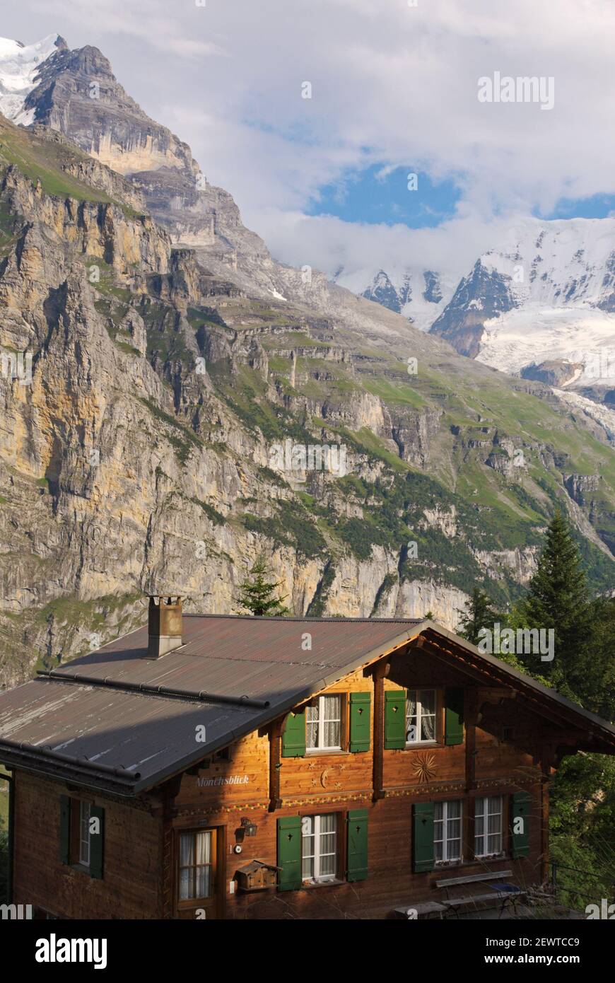 a chalet under the Jungfrau massif, Bernese Alps, Switzerland Stock Photo