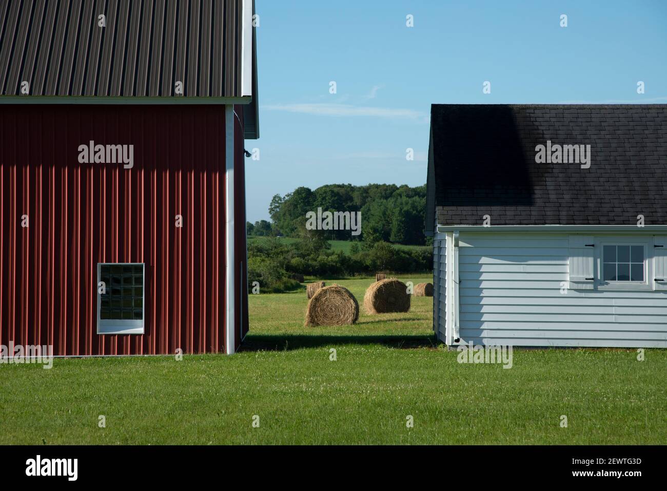 Farm houses with round hay bales in Door County Wisconsin Stock Photo