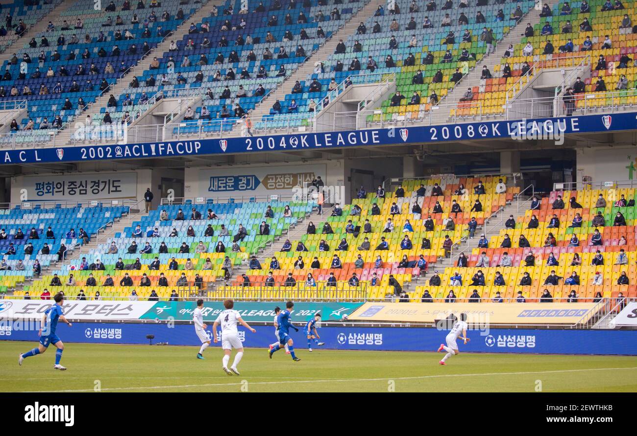 Spectators wearing face masks are seen during the 1st round of the 2021 K League match between Suwon Samsung Bluewings FC and Gwangju FC at the Suwon World Cup Stadium. (Final score; Suwon Samsung Bluewings FC 1:0 Gwangju FC) Stock Photo