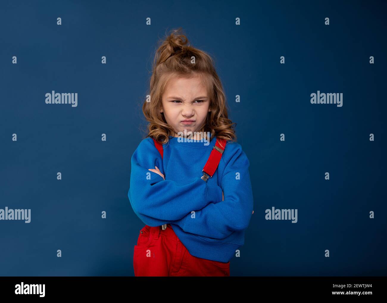 Spoiled child, naughty baby, kids whims. Beautiful little girl showing character. Child crisis psychology concept. Close-up photo Stock Photo