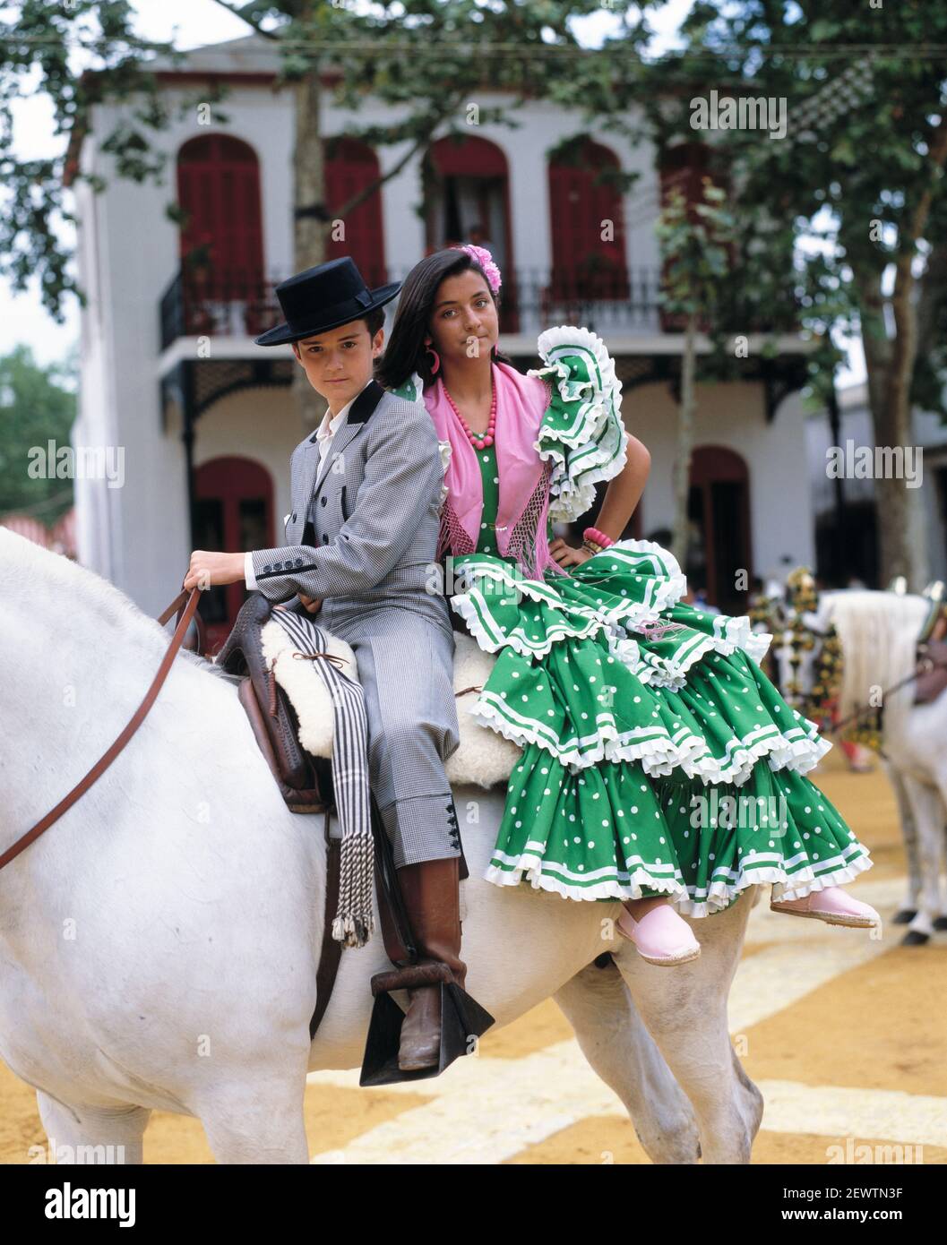 Spain. Andalusia. The Jerez Horse Fair. Children in costumes on horse back. Stock Photo