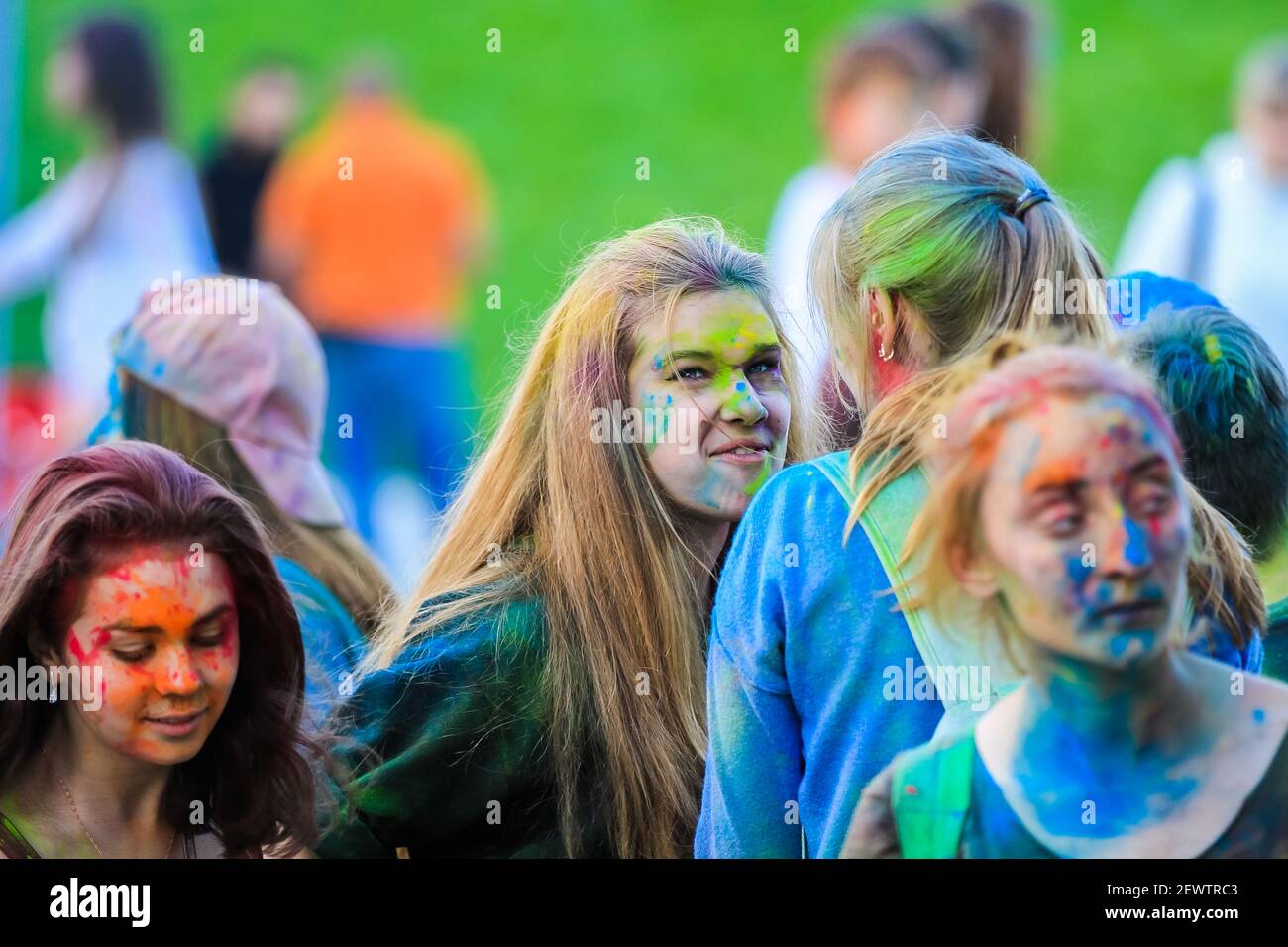 Russia, Moscow - June 25, 2017. Portrait of a girl with bright colors on her face. Holi is a traditional holiday in India Stock Photo