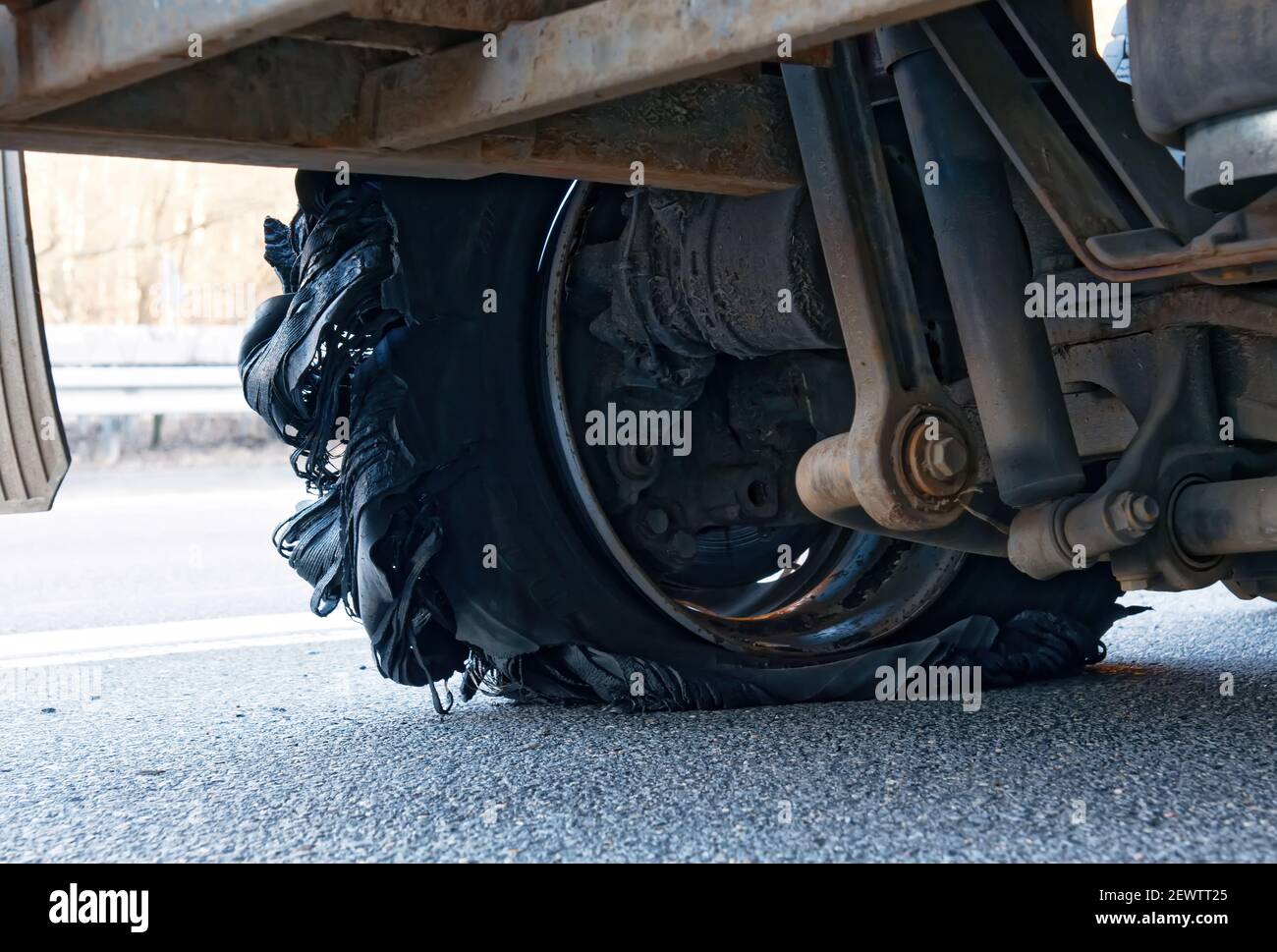 Close up of a truck with burst tyre on the motorway. Flat tire and Tire burst on the road Stock Photo