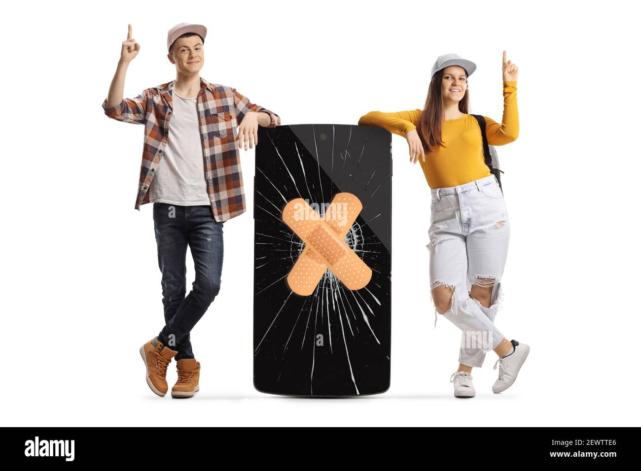 Full length portrait of male and female students leaning on a mobile phone with cracked screen and bandage and pointing up isolated on white backgroun Stock Photo