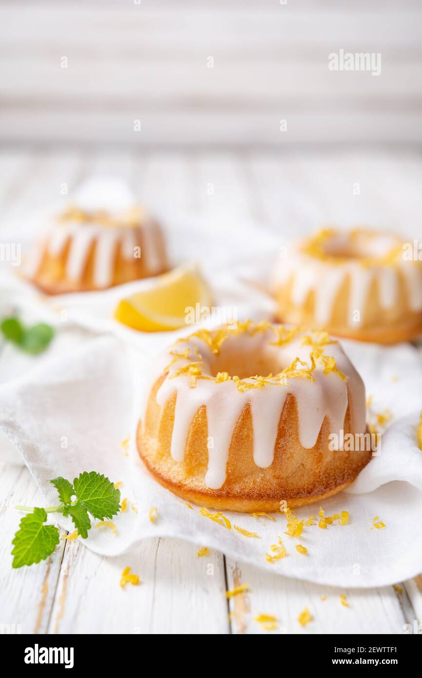 Tangy mini lemon bundt cakes topped with lemon glaze Stock Photo Alamy