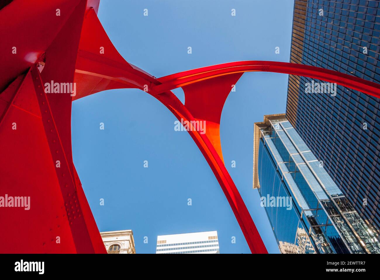Looking up at Calder's Flamingo or stabile, was unveiled to the public in 1974.it is situated at 50 W Adams St, Chicago, IL 60610 Stock Photo