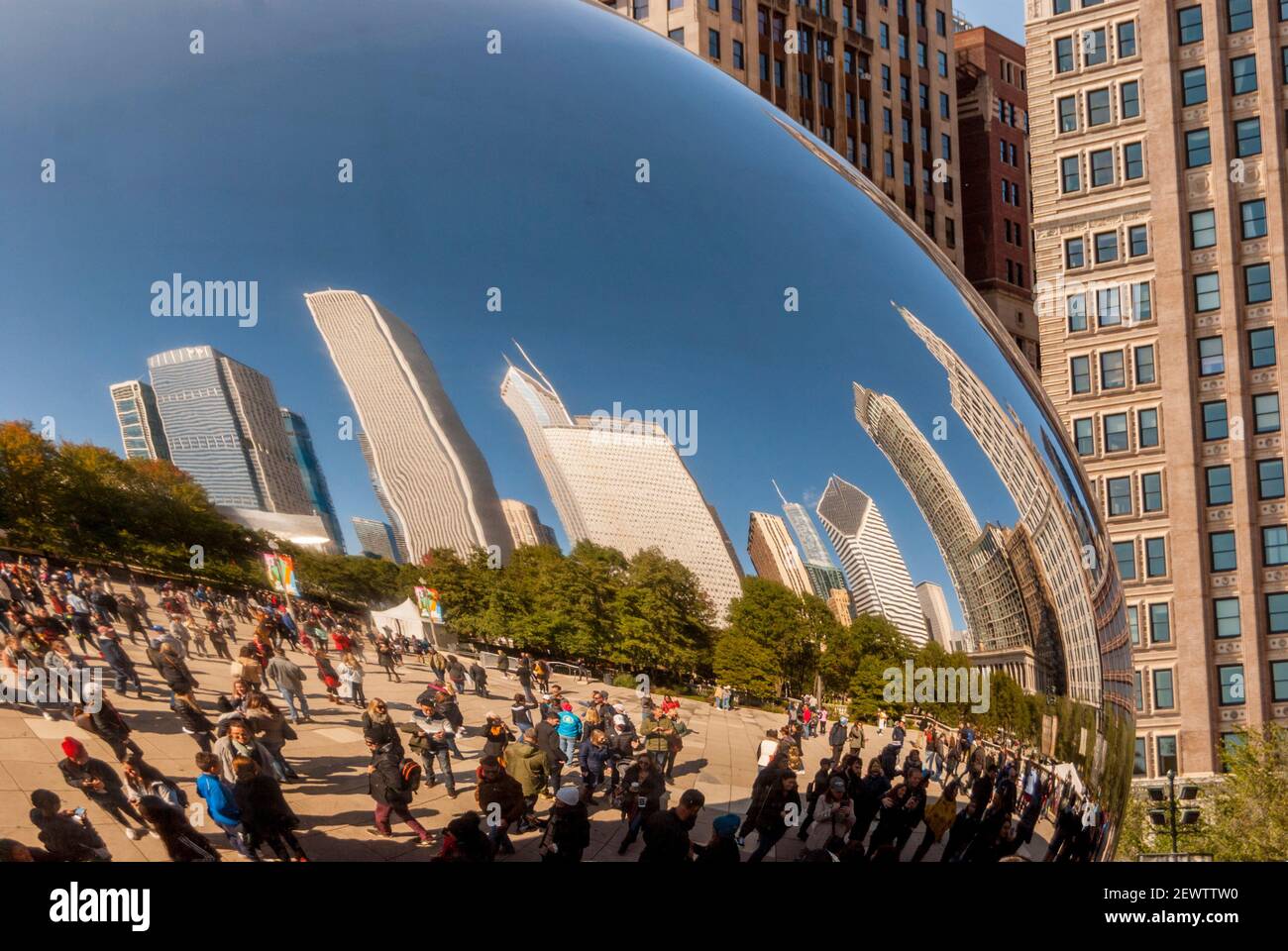 Chicago skyline reflected in the mirrored surface of Cloud Gate a Huge  sculpture shaped like a bean by Indian-born British artist Sir Anish Kapoorr Stock Photo